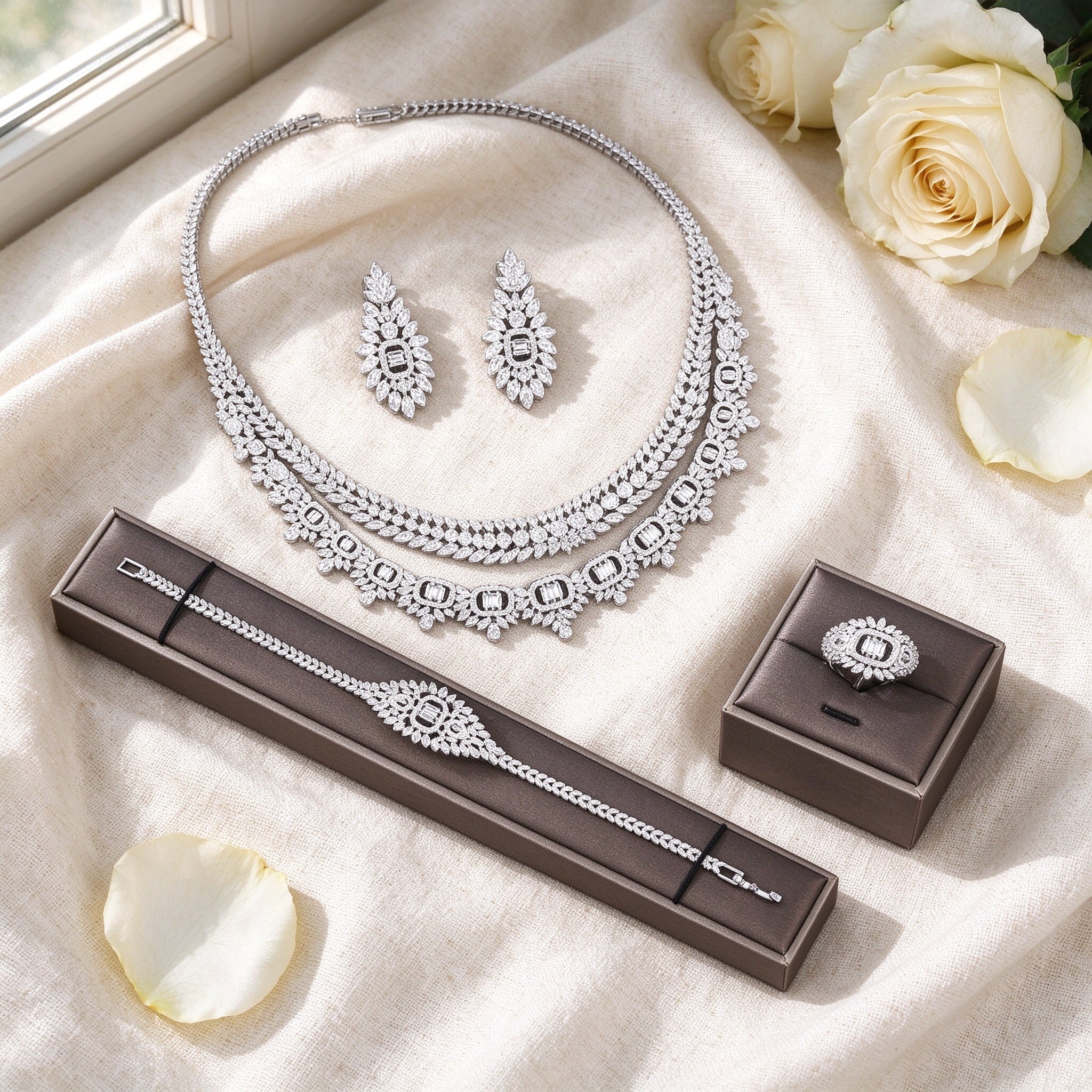 Flat lay of Reed necklace and earrings on cream linen