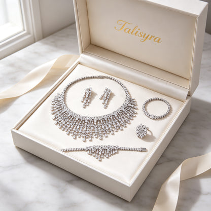 The Comet Crystal Parure four-piece set presented in a Talisyra ivory satin-lined gift box