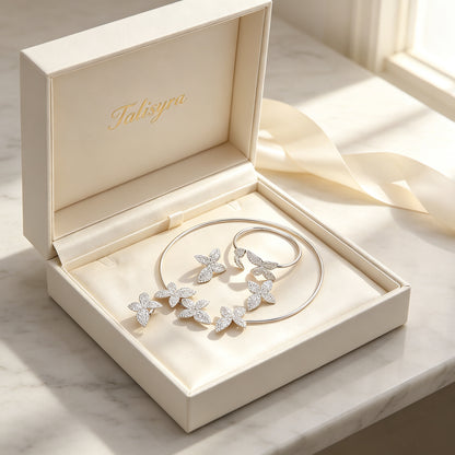 The Stella Bridal Set pavé orchid four-piece set presented in a Talisyra ivory satin-lined gift box