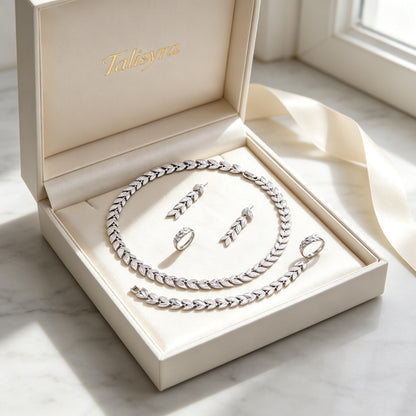 The Stella Bridal Parure laurel-leaf four-piece set presented in a Talisyra ivory satin-lined gift box