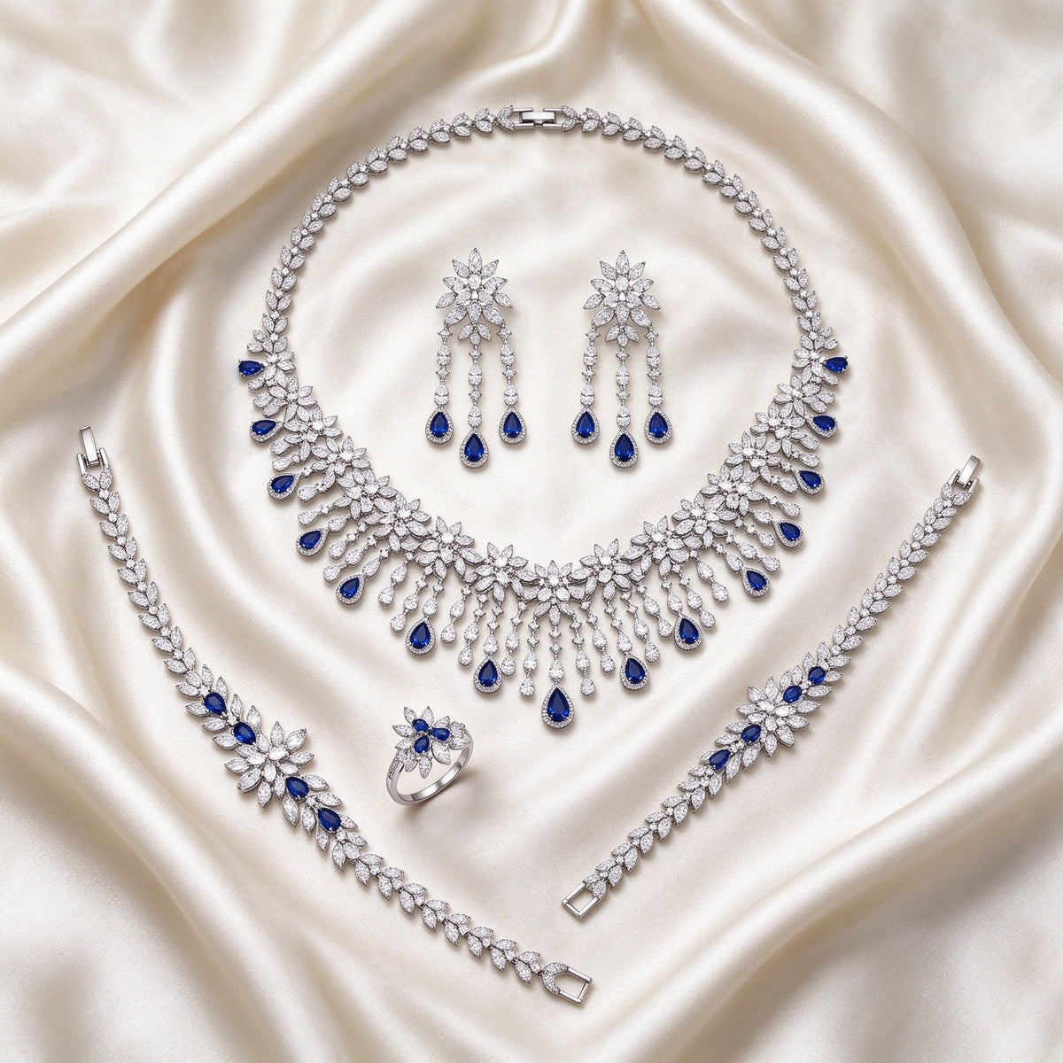 The Finley Bridal Parure – complete four-piece set laid flat on cream silk satin