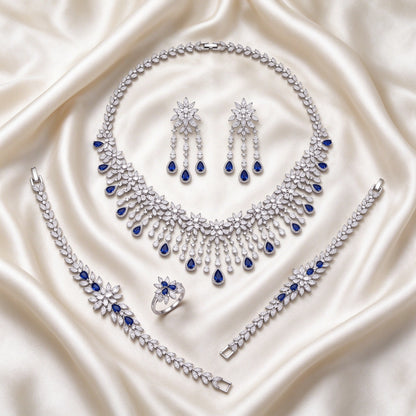 The Finley Bridal Parure – complete four-piece set laid flat on cream silk satin