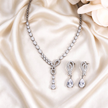 The Cameron Bridal Set – necklace and matching earrings laid flat on cream silk satin