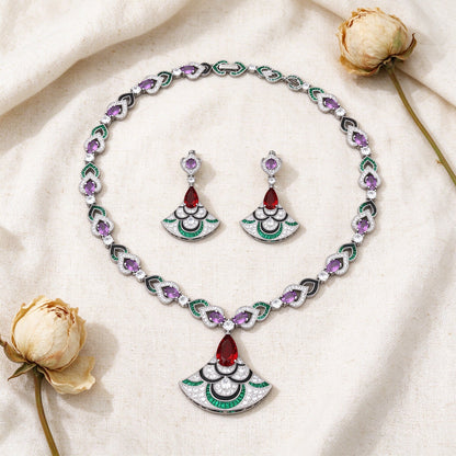 Overhead flat lay of The Camellia Bridal Parure necklace and fan-drop earrings on warm cream linen with dried peony buds