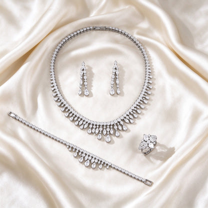 The Harper Crystal Parure – complete four-piece crystal parure laid flat on cream silk satin