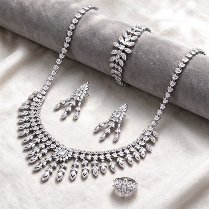 Silver-tone Eve bridal jewelry set flat lay on ivory linen