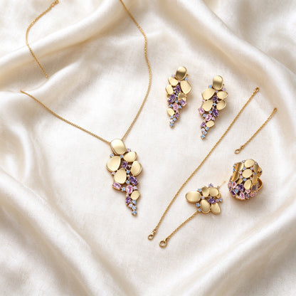 The Aurelia Bridal Set – complete four-piece set laid flat on cream silk