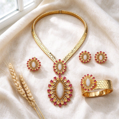 Top-down flat lay of The Solstice Bridal Set four-piece gold sunburst bridal set on ivory linen with wheat