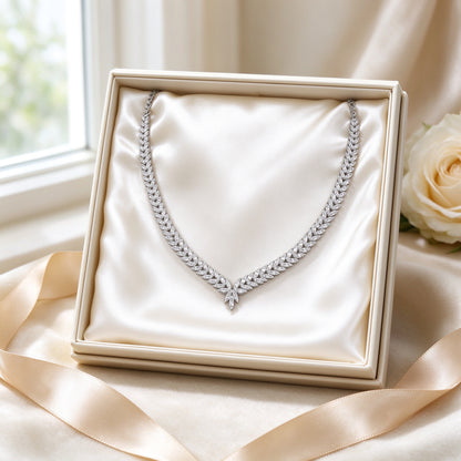 The Gardenia Wedding Suite necklace presented on ivory satin in a cream keepsake gift box