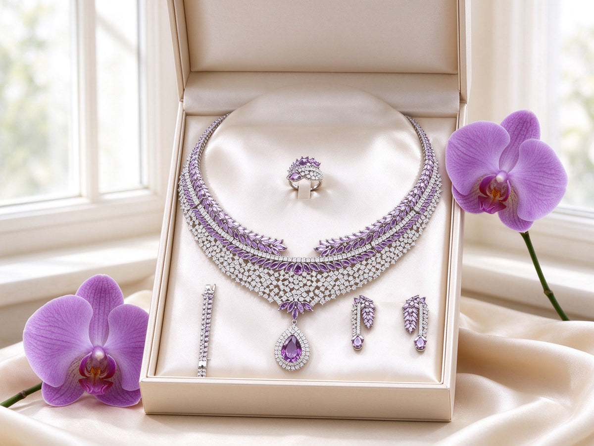 The Branch Bridal Set gift boxed in ivory Talisyra packaging with a purple orchid