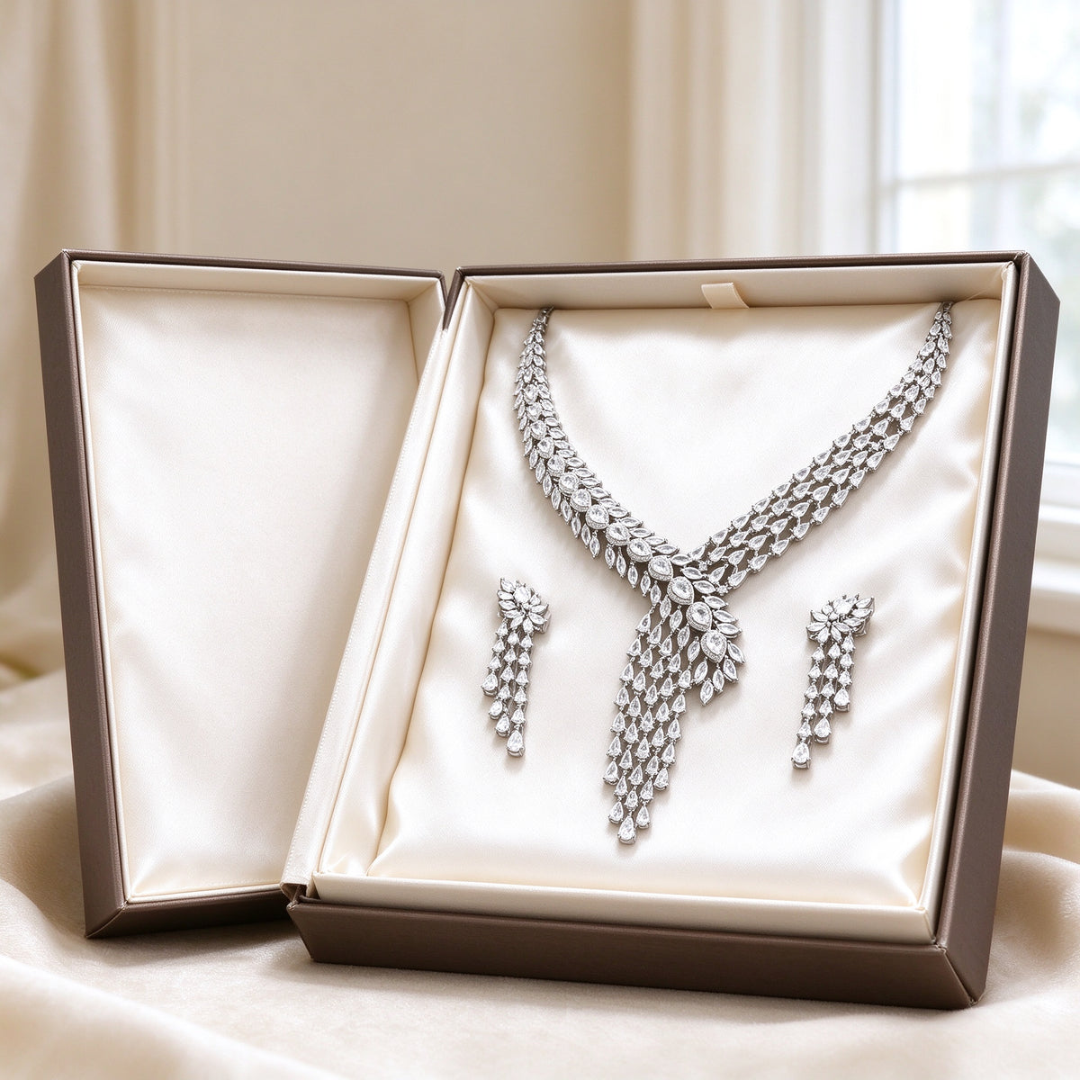 The Marigold Wedding Suite necklace and earrings presented in an ivory satin-lined gift box