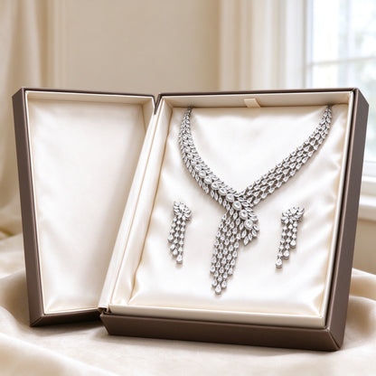 The Marigold Wedding Suite necklace and earrings presented in an ivory satin-lined gift box