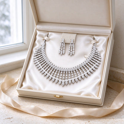 The Jasmine Bridal Set necklace and earrings in an open ivory cream gift box with satin lining and champagne ribbon