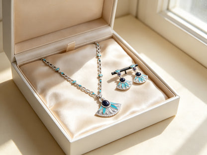 The Evangeline Crystal Suite presented in an open ivory jewelry box lined with champagne silk satin