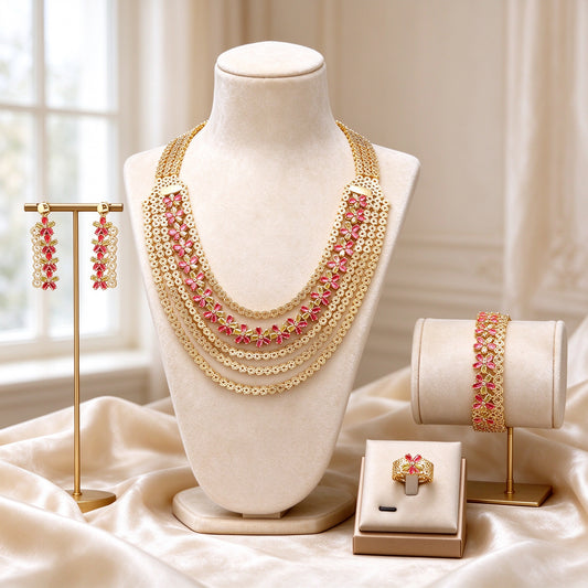 The Brook Wedding Suite gold-tone layered filigree fringe CZ statement set on an ivory velvet bust