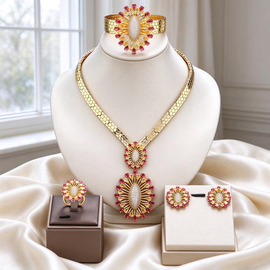The Solstice Bridal Set gold honeycomb collar with red-and-champagne sunburst pendants, earrings, ring and cuff on ivory silk