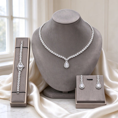 The Fern Wedding Suite silver-tone fern-textured pear-drop CZ necklace on warm grey velvet bust