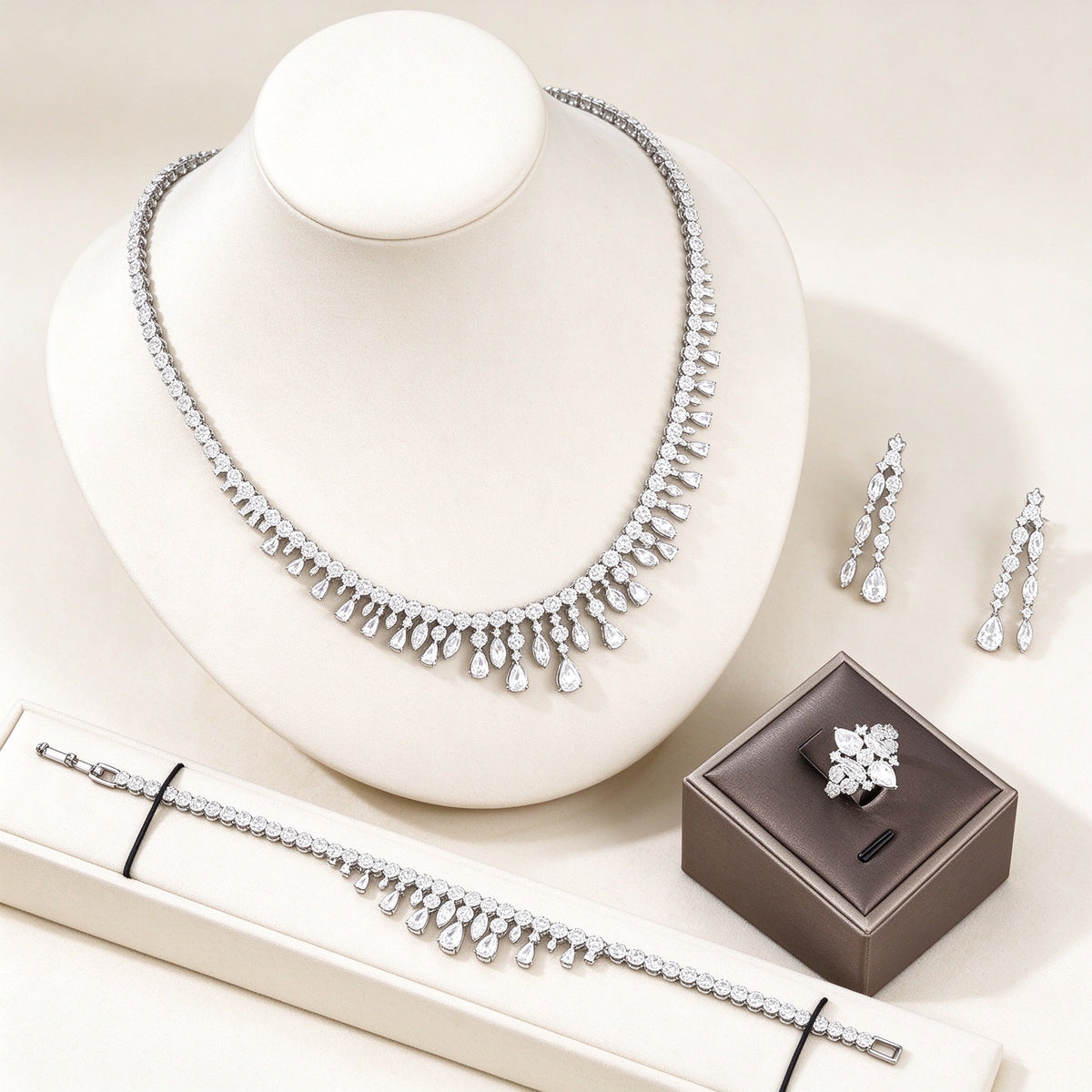 The Harper Crystal Parure – silver-tone pavé CZ graduated fringe collar necklace with pear and marquise drops on ivory
