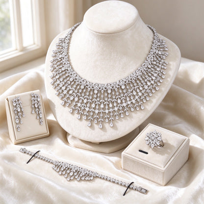 The Comet Crystal Parure — fringed CZ bib necklace, chandelier earrings, bracelet and ring in ivory styling