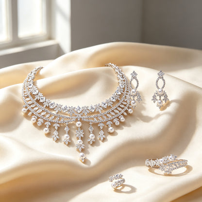 The Violet Bridal Parure four-piece pearl and CZ bridal jewelry set on ivory silk