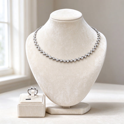 The Summit Wedding Suite laurel-vine CZ collar necklace on an ivory velvet bust