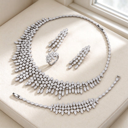 The Dusk Wedding Suite — cascading CZ bib necklace set on ivory
