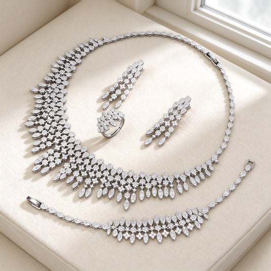 The Dusk Wedding Suite — cascading CZ bib necklace set on ivory
