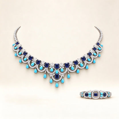 The Riley Bridal Parure – silver-tone pavé CZ scalloped bib necklace with turquoise teardrop fringe on ivory