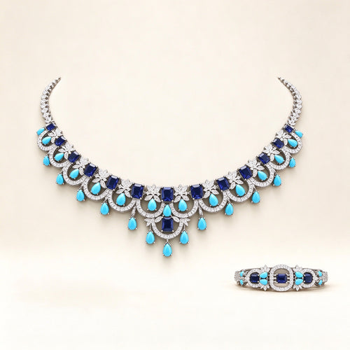 The Riley Bridal Parure – silver-tone pavé CZ scalloped bib necklace with turquoise teardrop fringe on ivory