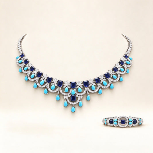 The Riley Bridal Parure – silver-tone pavé CZ scalloped bib necklace with turquoise teardrop fringe on ivory