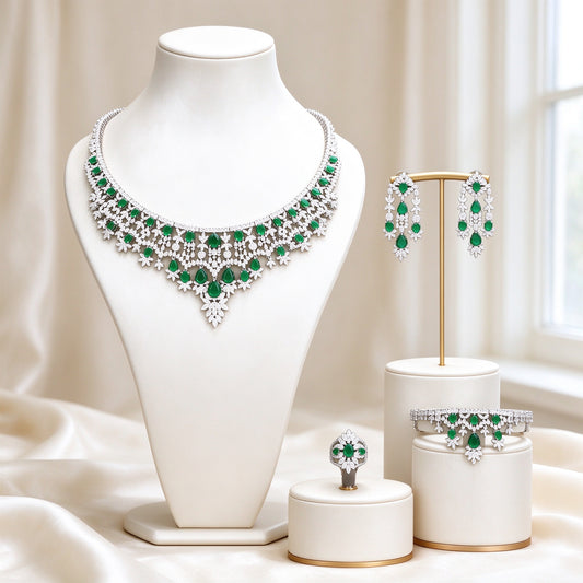 The Rain Crystal Parure silver-tone V-shaped necklace with emerald teardrop CZ on ivory bust