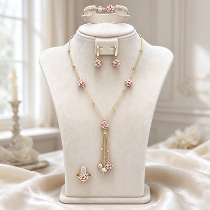 The Poppy Crystal Parure gold-tone floral lariat bridal jewelry set on an ivory velvet bust