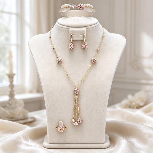 The Poppy Crystal Parure gold-tone floral lariat bridal jewelry set on an ivory velvet bust