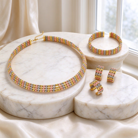 The Emerson Wedding Suite - tri-tone woven bead choker collar, open-cuff bangle, cluster earrings and ring on ivory marble pedestals