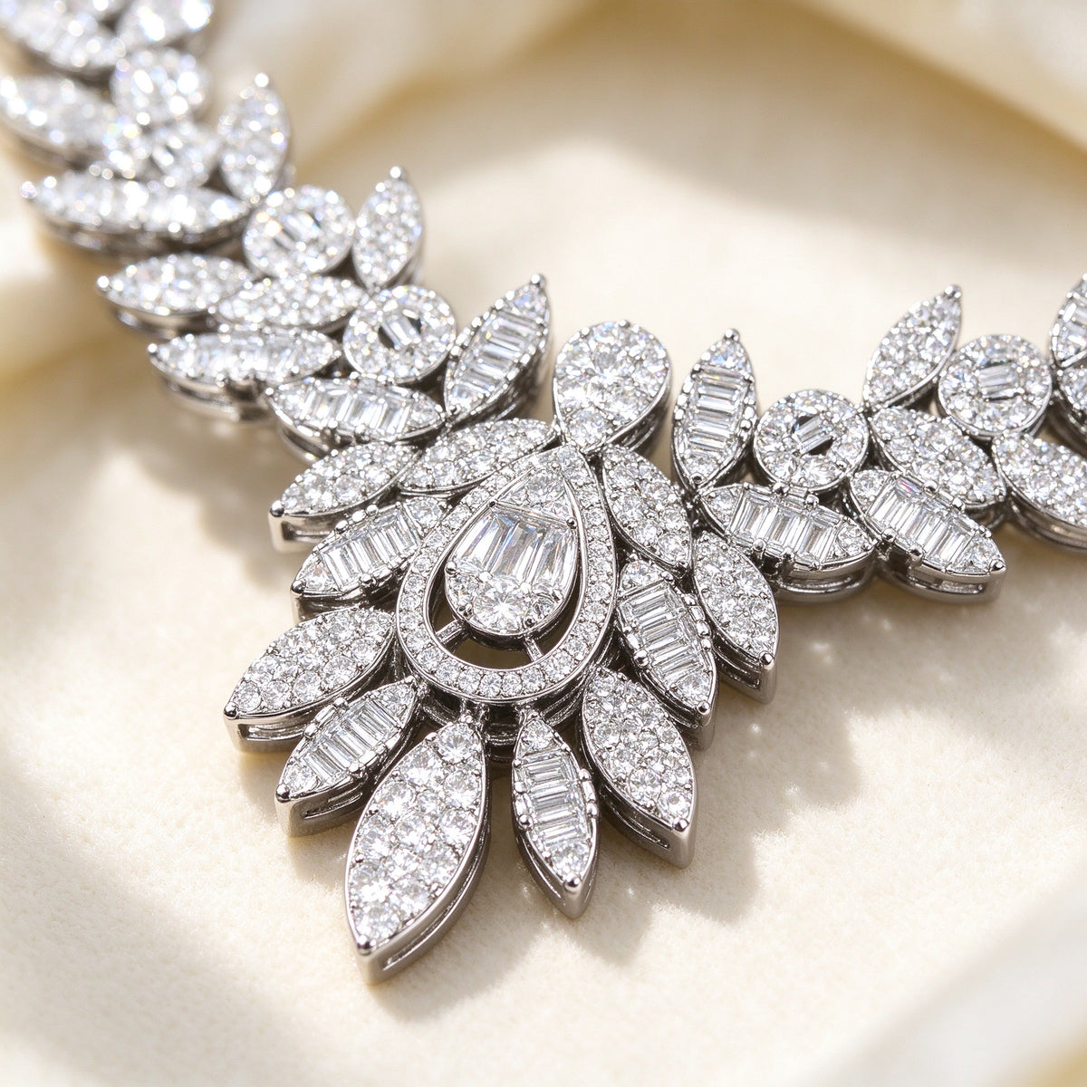 Macro of the Ash necklace teardrop pendant with marquise and round CZ leaves