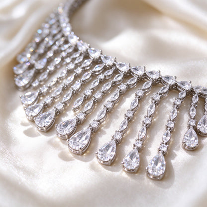 Macro close-up of cascading pear and marquise cut clear cubic zirconia fringe drops
