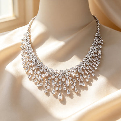Macro close-up of The Vivienne layered marquise, baguette and pear-shaped clear cubic zirconia fringe on ivory silk