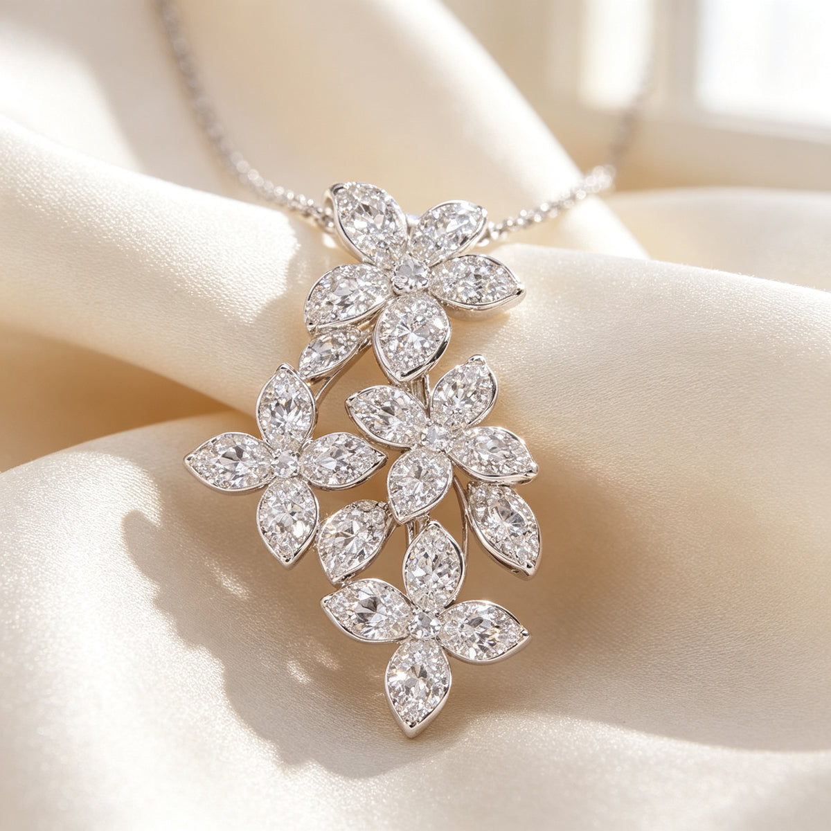 Macro detail of micro-pavé cubic zirconia five-petal blossoms on cream silk
