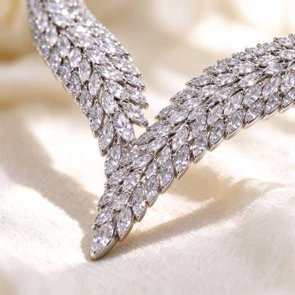 Macro detail of marquise-cut cubic zirconia leaf pattern in silver rhodium