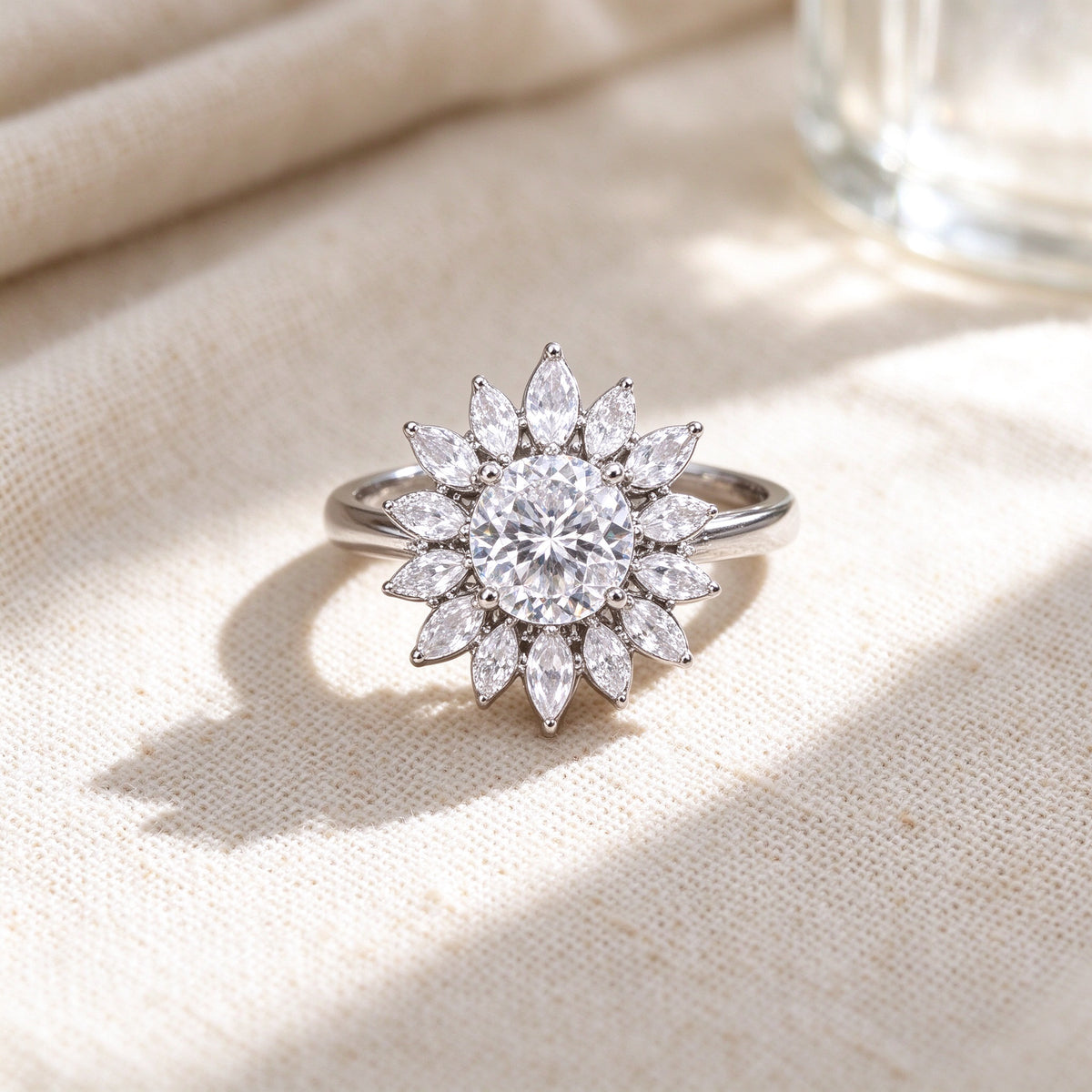 Macro of round center cubic zirconia ringed by marquise petals