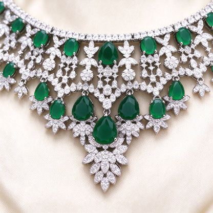 Macro detail of The Rain Crystal Parure V-shaped emerald CZ necklace