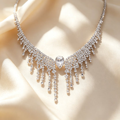 Macro close-up of The Genevieve central pear teardrop cubic zirconia and graduated cascading fringe on ivory silk
