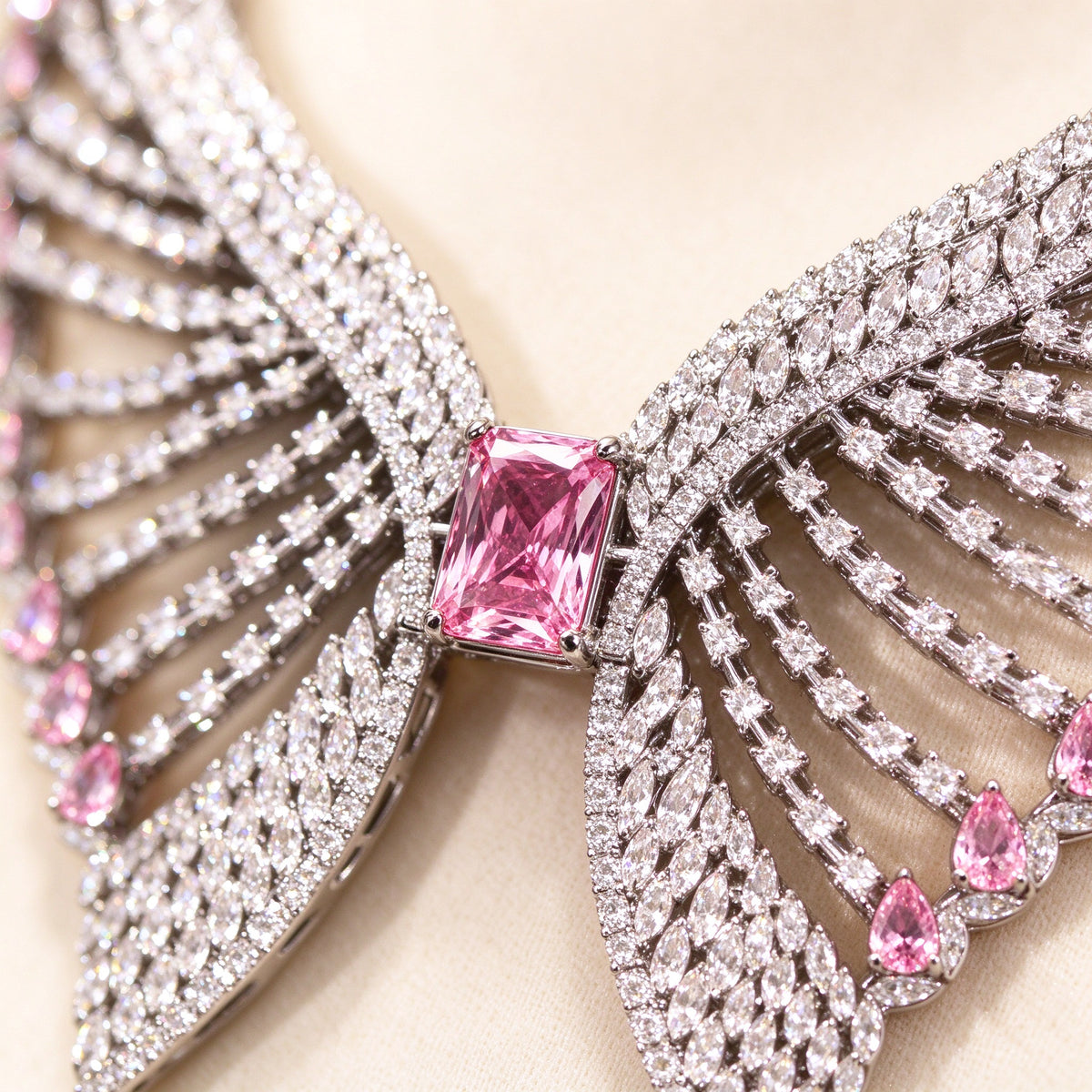 Macro close-up of a pink emerald-cut cubic zirconia surrounded by radiating clear CZ feathered rows