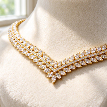 Macro detail of The Daybreak Wedding Suite V-chevron marquise-cut CZ laurel weave tapering to its point