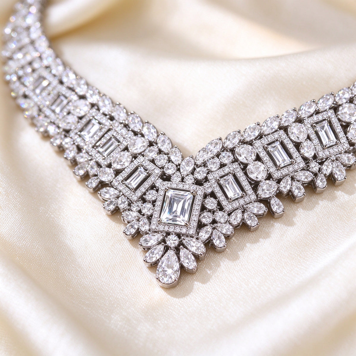 Macro detail of The Diadem Bridal Parure V-collar necklace center with rectangular step-cut clear CZ