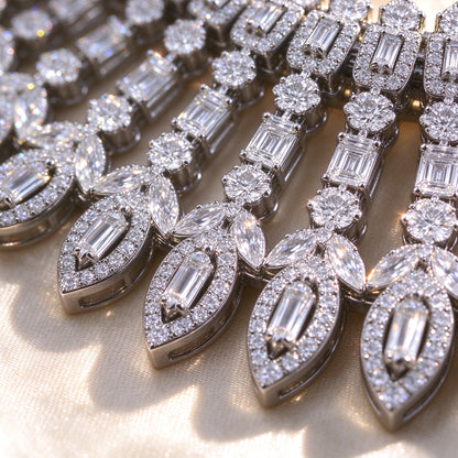 Macro detail of The Jasmine Bridal Set necklace fringe showing alternating baguette and marquise cubic zirconia stones on champagne silk