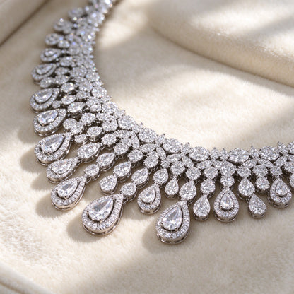Macro detail of The Moonlight Bridal Set graduating bezel-set pear-cut teardrops and dense round pavé CZ