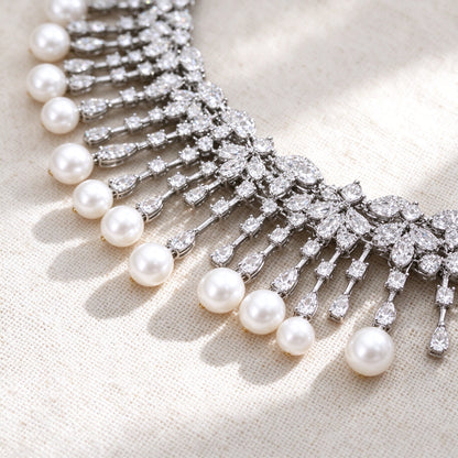 Macro of graduated white pearl drops and cubic zirconia pavé
