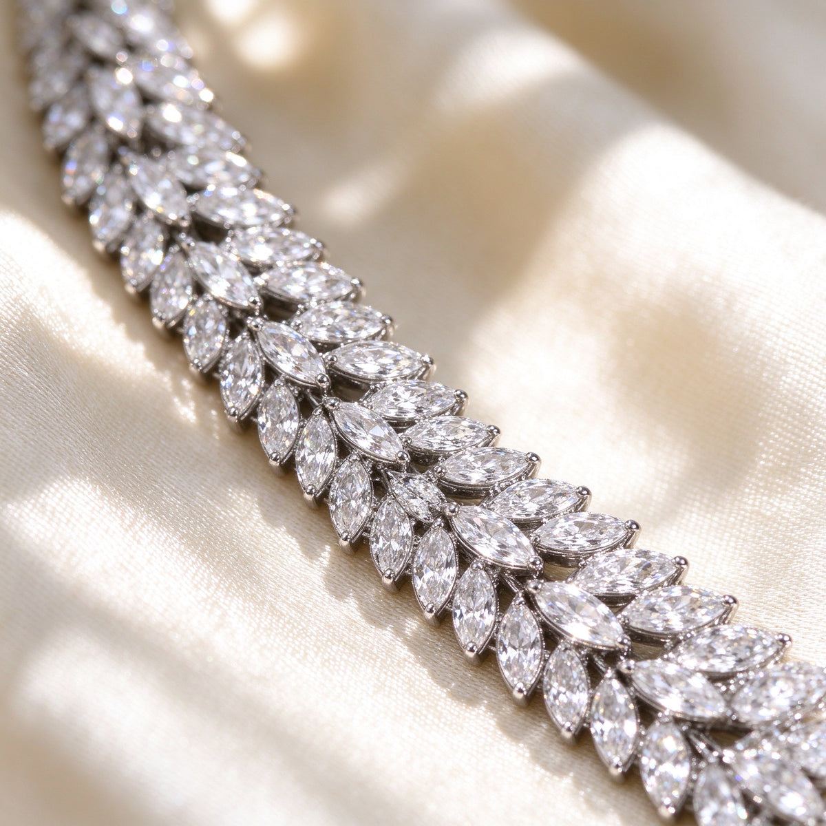 Macro of The Elowen Wedding Suite marquise-cut cubic zirconia laurel leaf detail