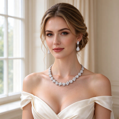 Western bride wearing The Celestia Wedding Suite alternating emerald and pear cut halo line necklace in soft window light